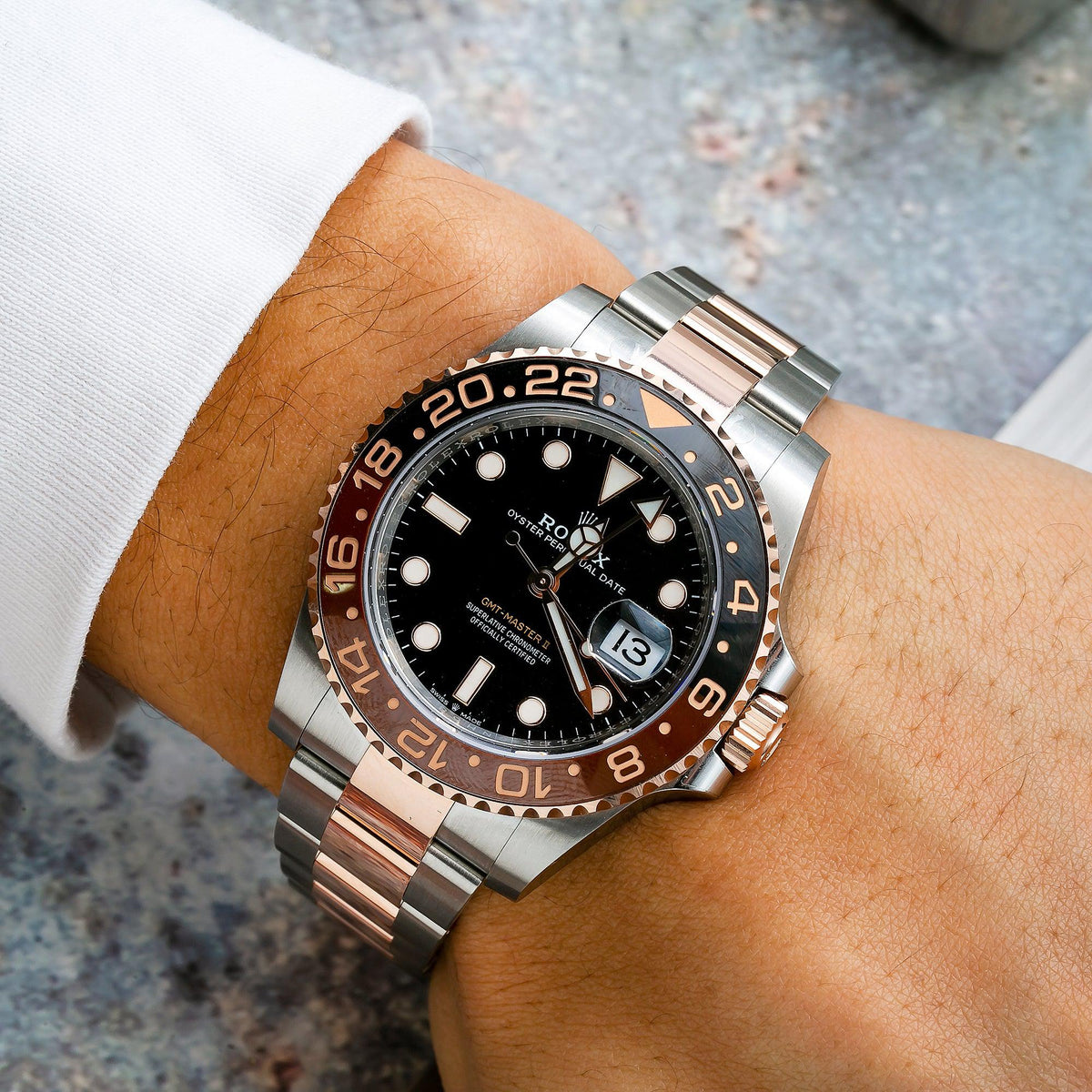 Rolex GMT-Master II 40MM 126711CHNR Root Beer Black Dial Black & Brown Ceramic Bezel Two Tone Rose Gold Oyster Bracelet worn on wrist
