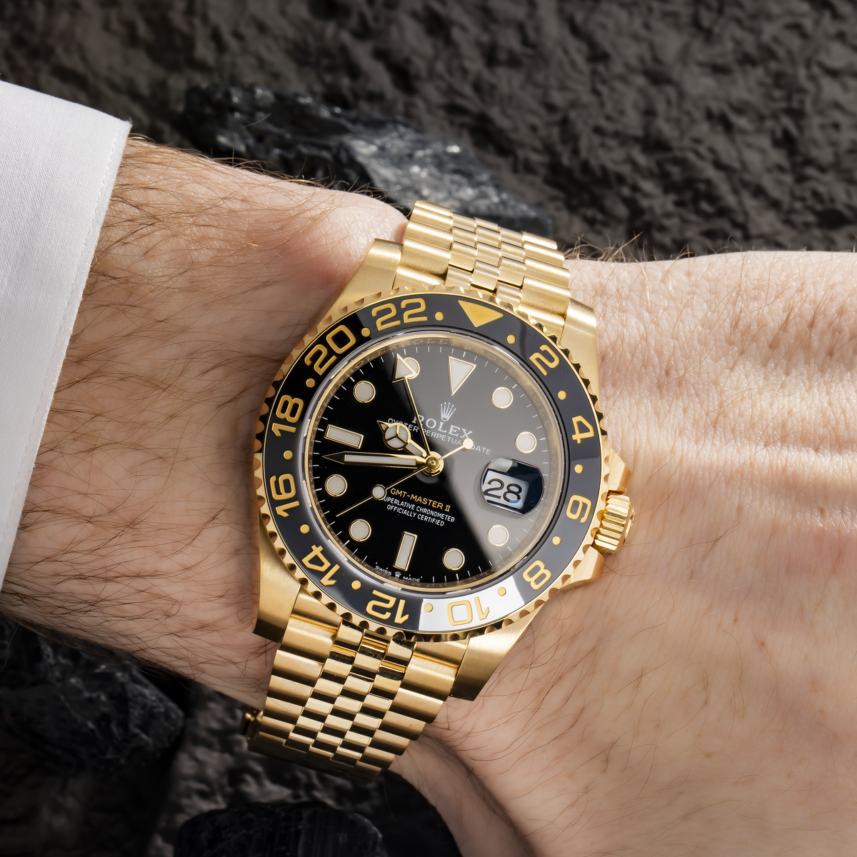Rolex GMT-Master II 40MM 126718GRNR Black Dial Black Ceramic Bezel 18K Yellow Gold Jubilee Bracelet worn on wrist