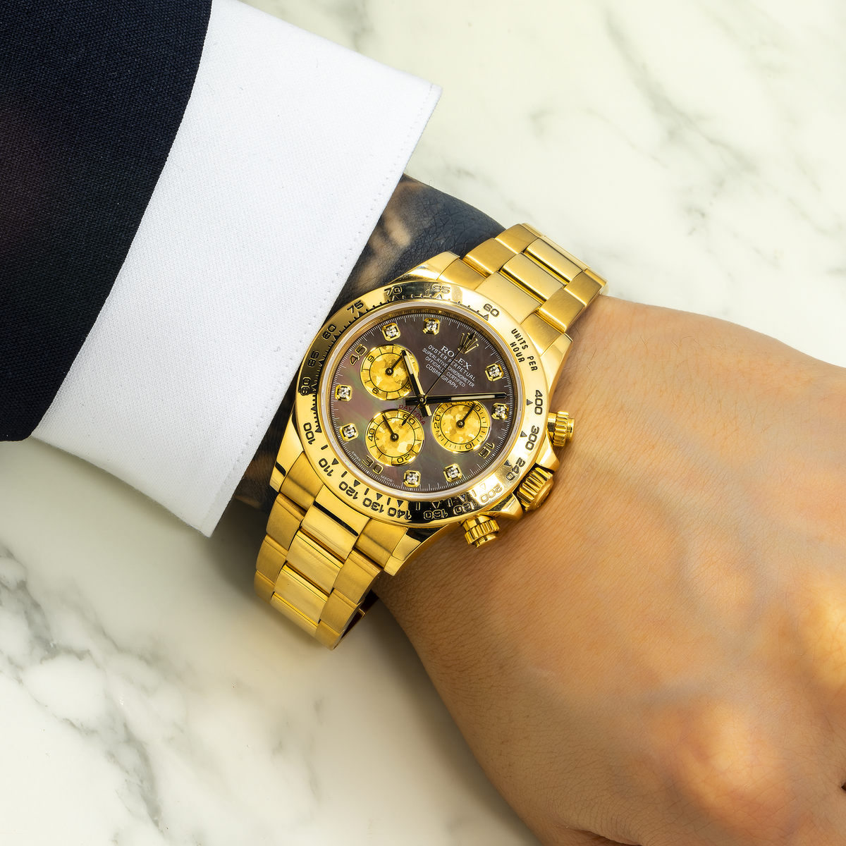 Rolex Cosmograph Daytona 40MM 116508 Black Mother of Pearl Diamond Dial Tachymeter Bezel 18K Yellow Gold Oyster Bracelet worn on wrist