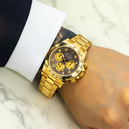 Rolex Cosmograph Daytona 40MM 116508 Black Mother of Pearl Diamond Dial Tachymeter Bezel 18K Yellow Gold Oyster Bracelet worn on wrist