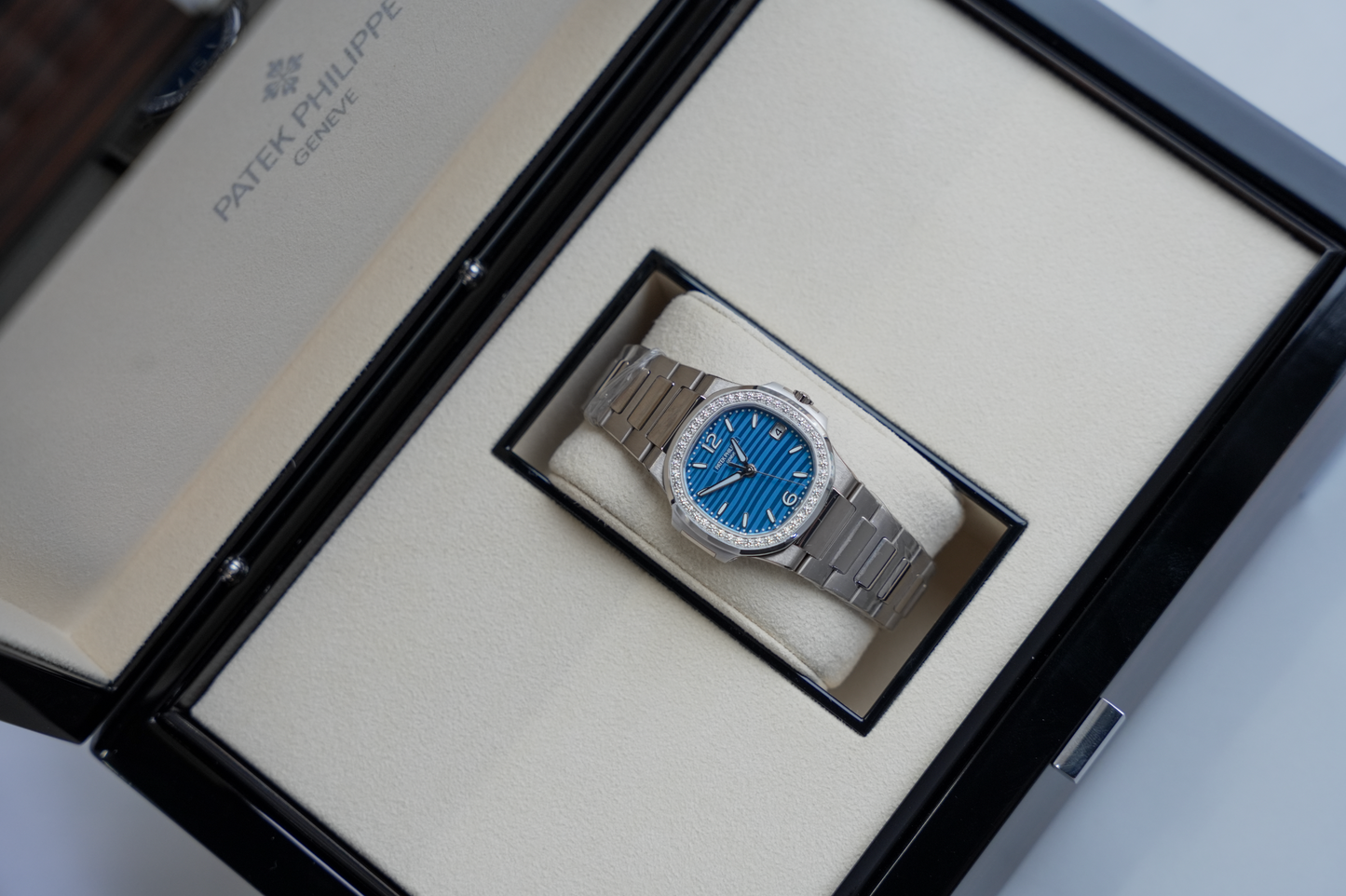 Patek Philippe Nautilus 7010/1G-013 18K White Gold Diamond Bezel Azure Blue Wave Dial 32mm Watch