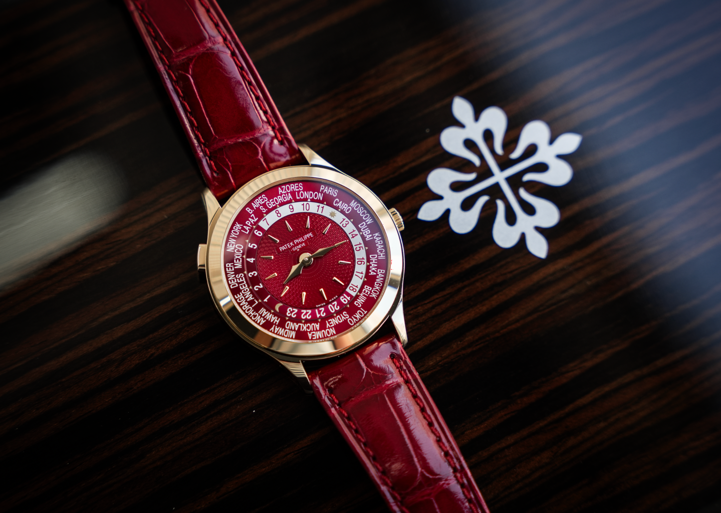 Patek Philippe Complications World Time 7129J-001 18K Yellow Gold Carmine Red Dial