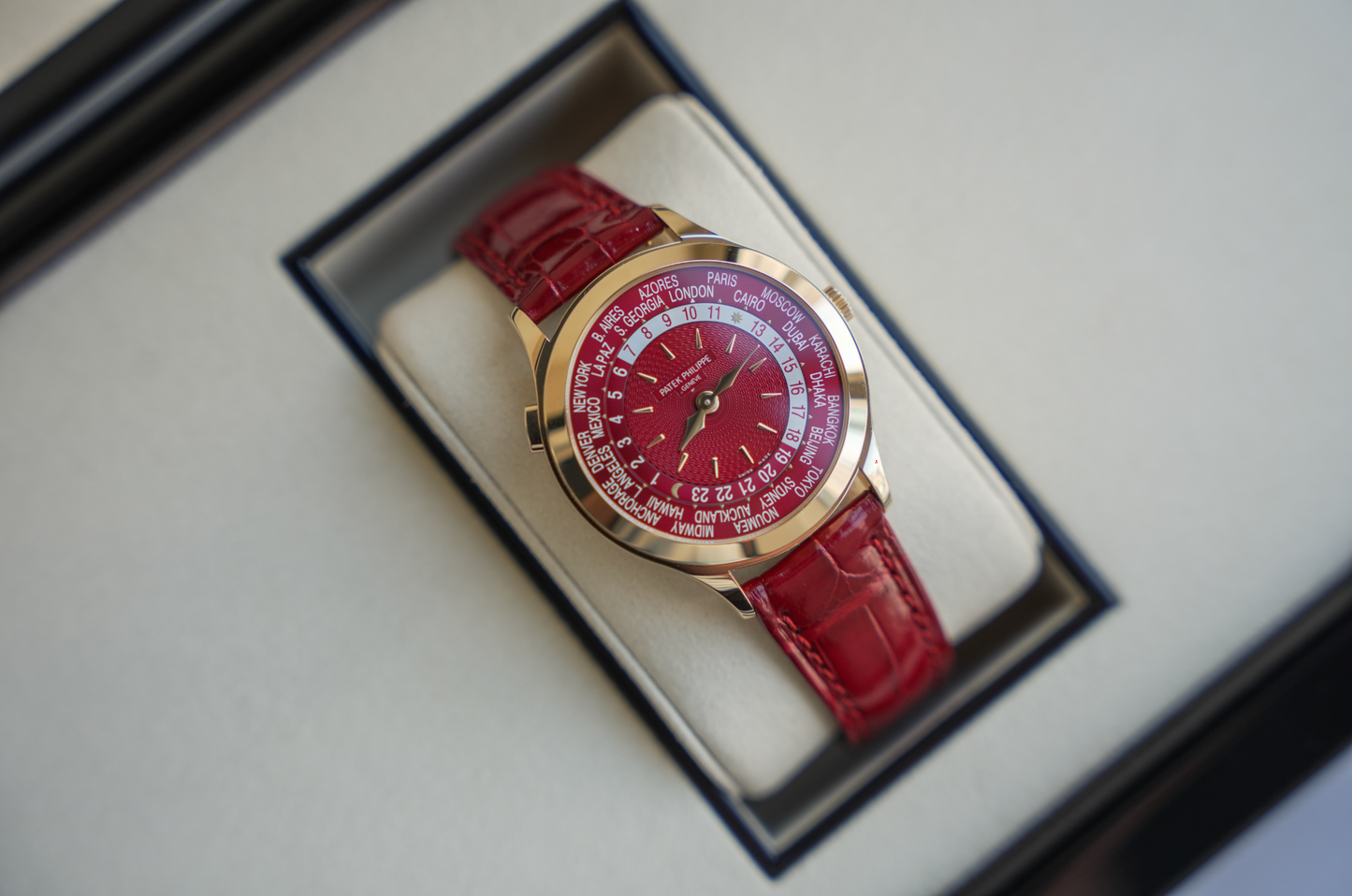 Patek Philippe Complications World Time 7129J-001 18K Yellow Gold Carmine Red Dial