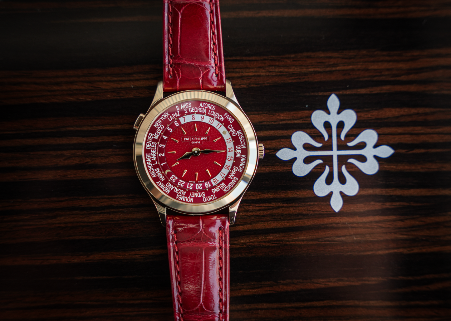 Patek Philippe Complications World Time 7129J-001 18K Yellow Gold Carmine Red Dial